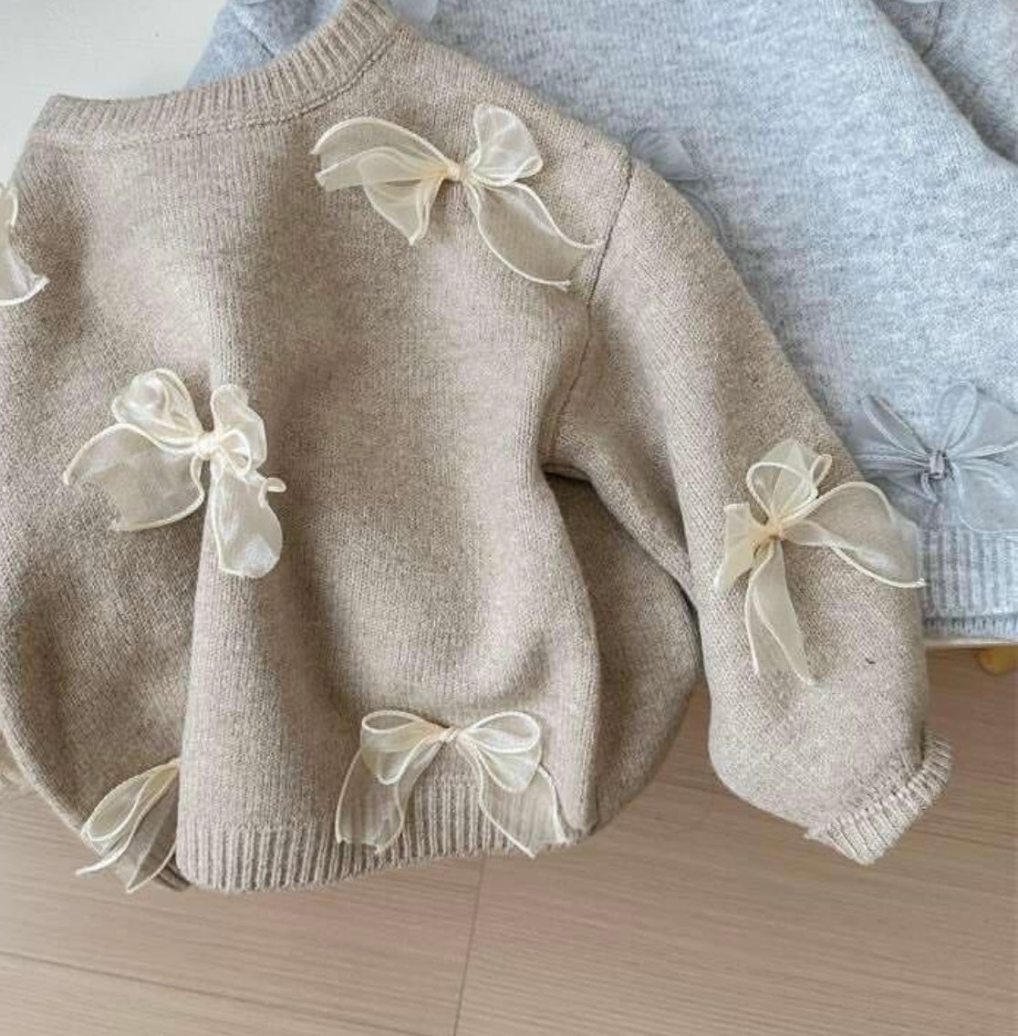 Bow knit trui